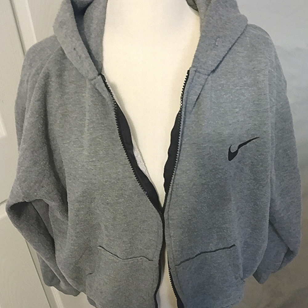 Nike jacket size medium gray, missing the draw string for the hood